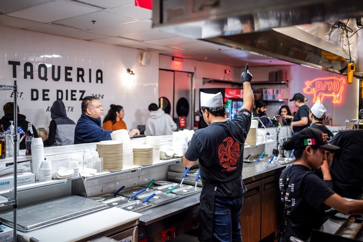 Taquero preparing tacos