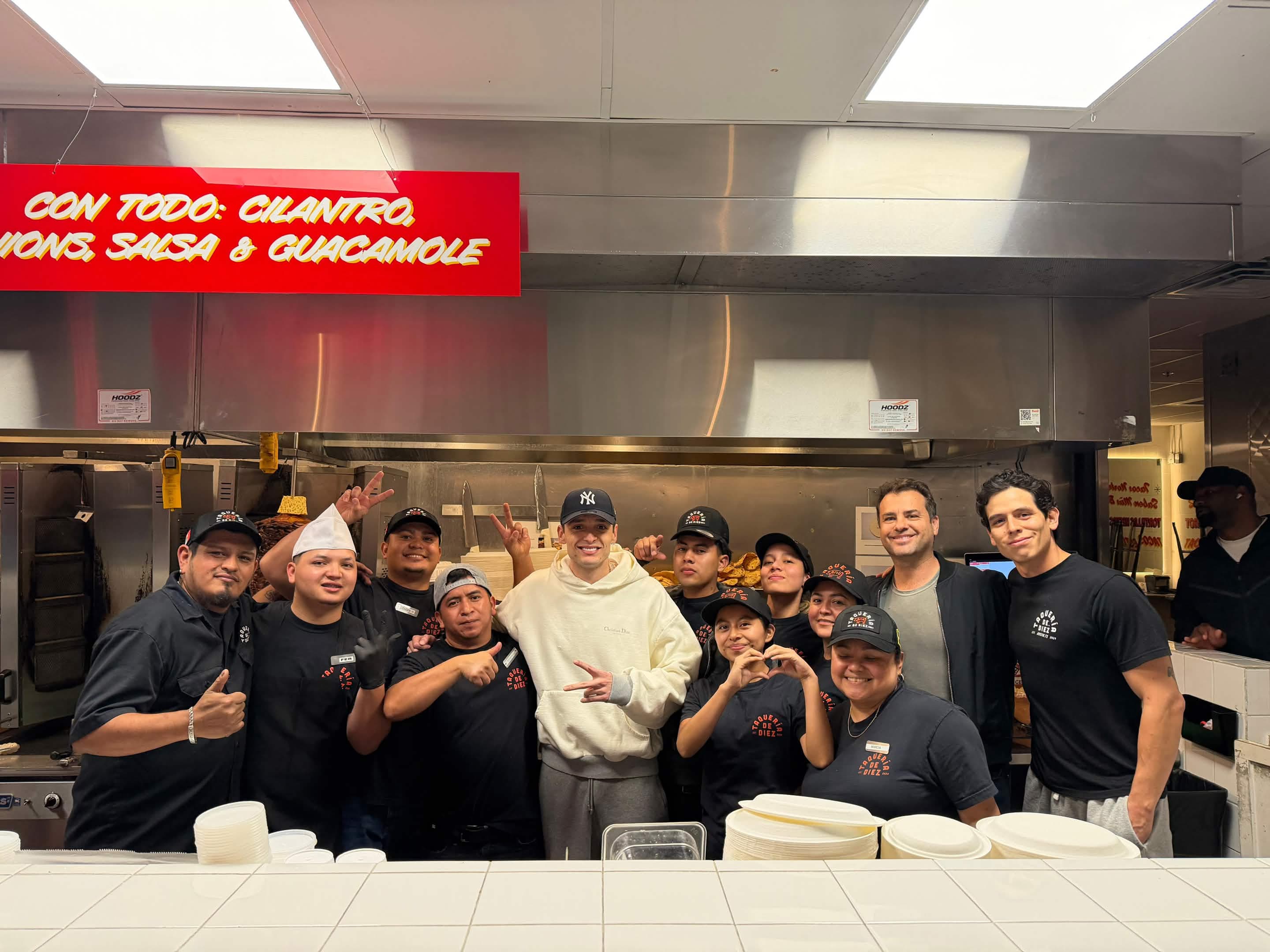 Peso Pluma with the Taqueria de Diez downtown team